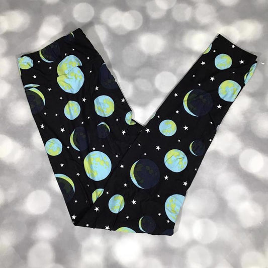 LuLaRoe black leggings featuring blue and green planet and star print - celestial orbit pattern