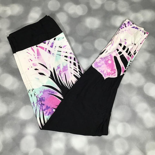 LuLaRoe leggings with black base and tropical palm watercolor design in pastel pink, purple, and aqua