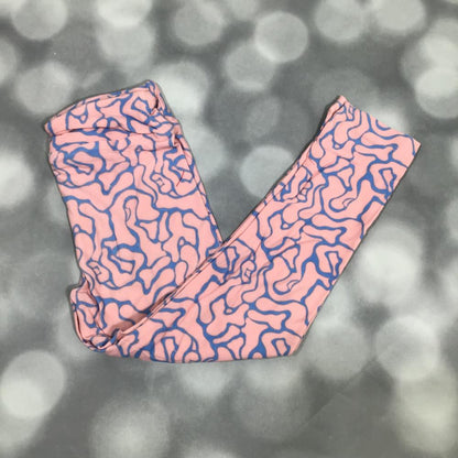 LuLaRoe leggings featuring a blush pink background with periwinkle blue abstract contour lines in a modern maze-inspired pattern. Women's colorful abstract print leggings with a playful artistic design on a blurred gray background