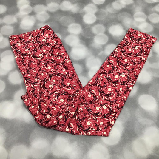 LuLaRoe leggings in Crimson Scroll Vine print featuring red background with black scrolling vine pattern and cream accents on a gray background