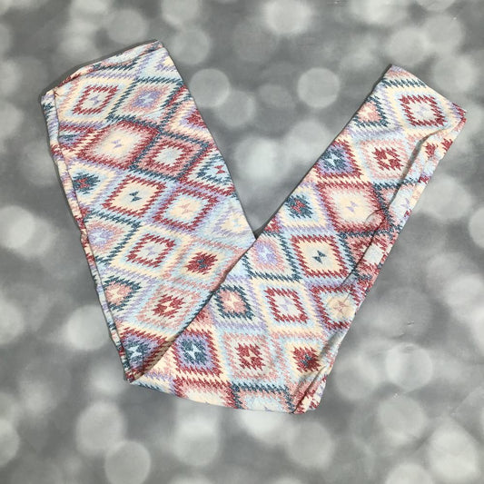 LuLaRoe leggings featuring a soft diamond-pattern print with a woven look in blush, teal, ivory, and denim blue tones, laid flat on a light gray background.