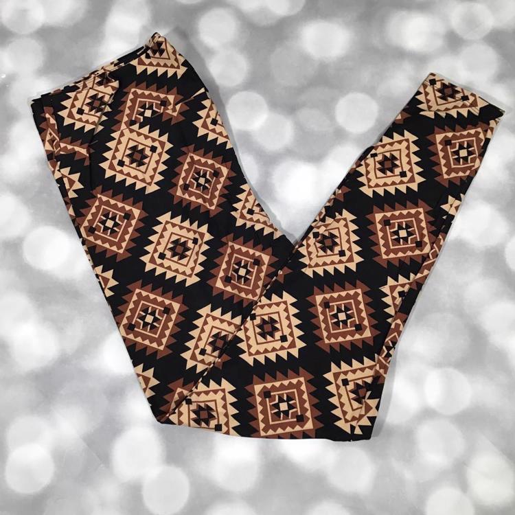 LuLaRoe leggings featuring a black background with tan, camel, and mocha brown Southwestern diamond geometric patterns. Women's leggings with an Aztec-inspired tribal design perfect for western fashion, boho outfits, and everyday casual wear.