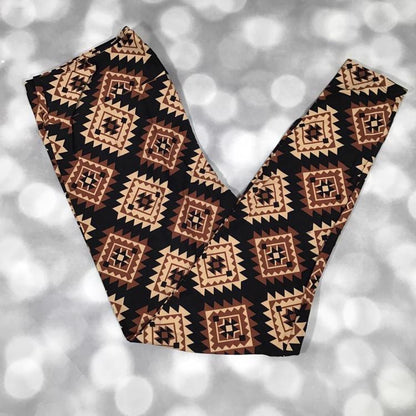 LuLaRoe leggings featuring a black background with tan, camel, and mocha brown Southwestern diamond geometric patterns. Women's leggings with an Aztec-inspired tribal design perfect for western fashion, boho outfits, and everyday casual wear.