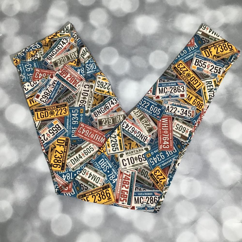 LuLaRoe leggings featuring an allover vintage license plate collage print with assorted U.S. state plates in blue, yellow, red, and cream tones, displayed flat on a light gray background