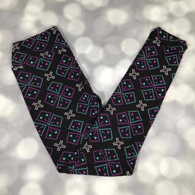 LuLaRoe leggings in Neon Mesa Mosaic geometric print with teal and purple diamond patterns and white accents on a black background