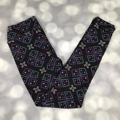LuLaRoe leggings in Neon Mesa Mosaic geometric print with teal and purple diamond patterns and white accents on a black background
