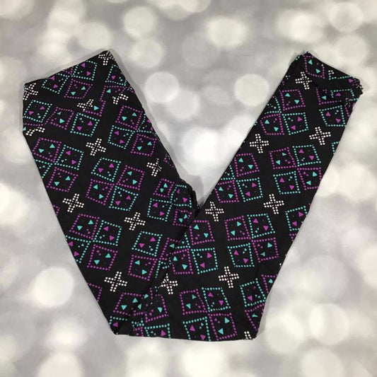 LuLaRoe leggings in Neon Mesa Mosaic geometric print with teal and purple diamond patterns and white accents on a black background