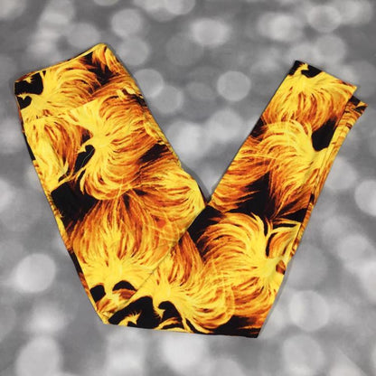 LuLaRoe leggings in Phoenix Reign with black background, gold and orange phoenix bird design, soft stretchy fabric, and bold statement print