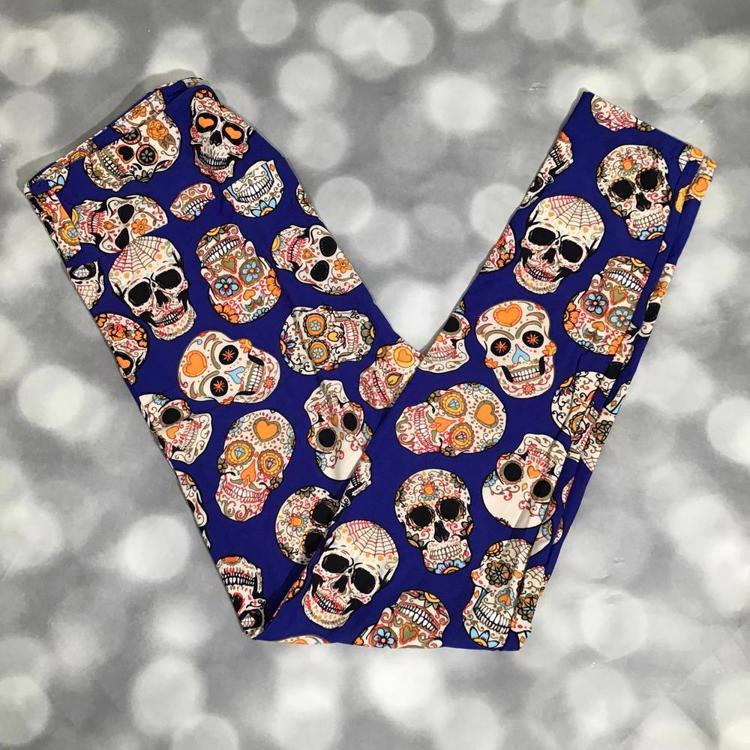 LuLaRoe leggings with vibrant sugar skulls on a royal blue background, Dia de los Muertos inspired print