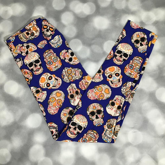 LuLaRoe leggings in royal blue with colorful sugar skull print featuring hearts and florals