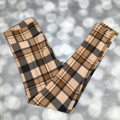 LuLaRoe leggings featuring a beige and camel plaid pattern with tan and black checks in a soft, cozy all-over design on a gray background