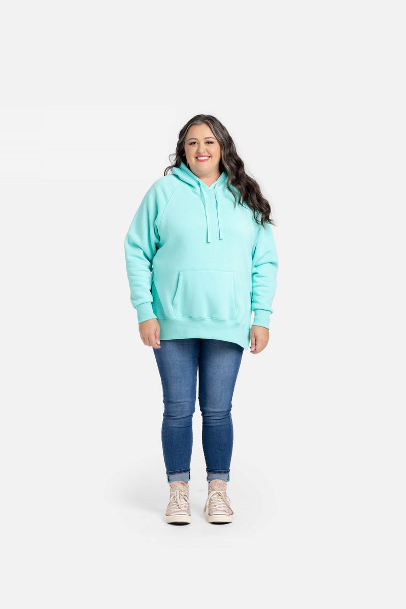 Lexi Hooded Fleece Sweatshirt in solid teal aqua displayed on a model. Relaxed-fit hoodie with raglan sleeves, kangaroo pocket, ribbed cuffs and hem, and side slits.