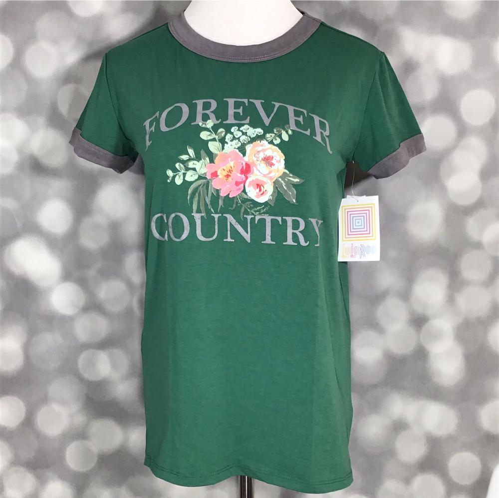 Front view of LuLaRoe Liv T on mannequin featuring forest green base, gray contrast neckline and cuffs, and ‘Forever Country’ floral design against a blurred background