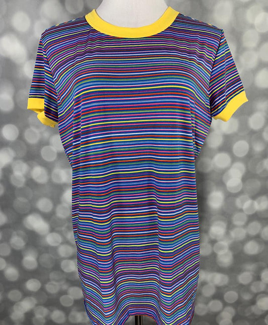 LuLaRoe Liv T in multicolor horizontal stripes with yellow contrast neckline and sleeve trim” | “Front view of LuLaRoe Liv T on mannequin featuring bright rainbow stripes with yellow collar and sleeve cuffs against a gray background.