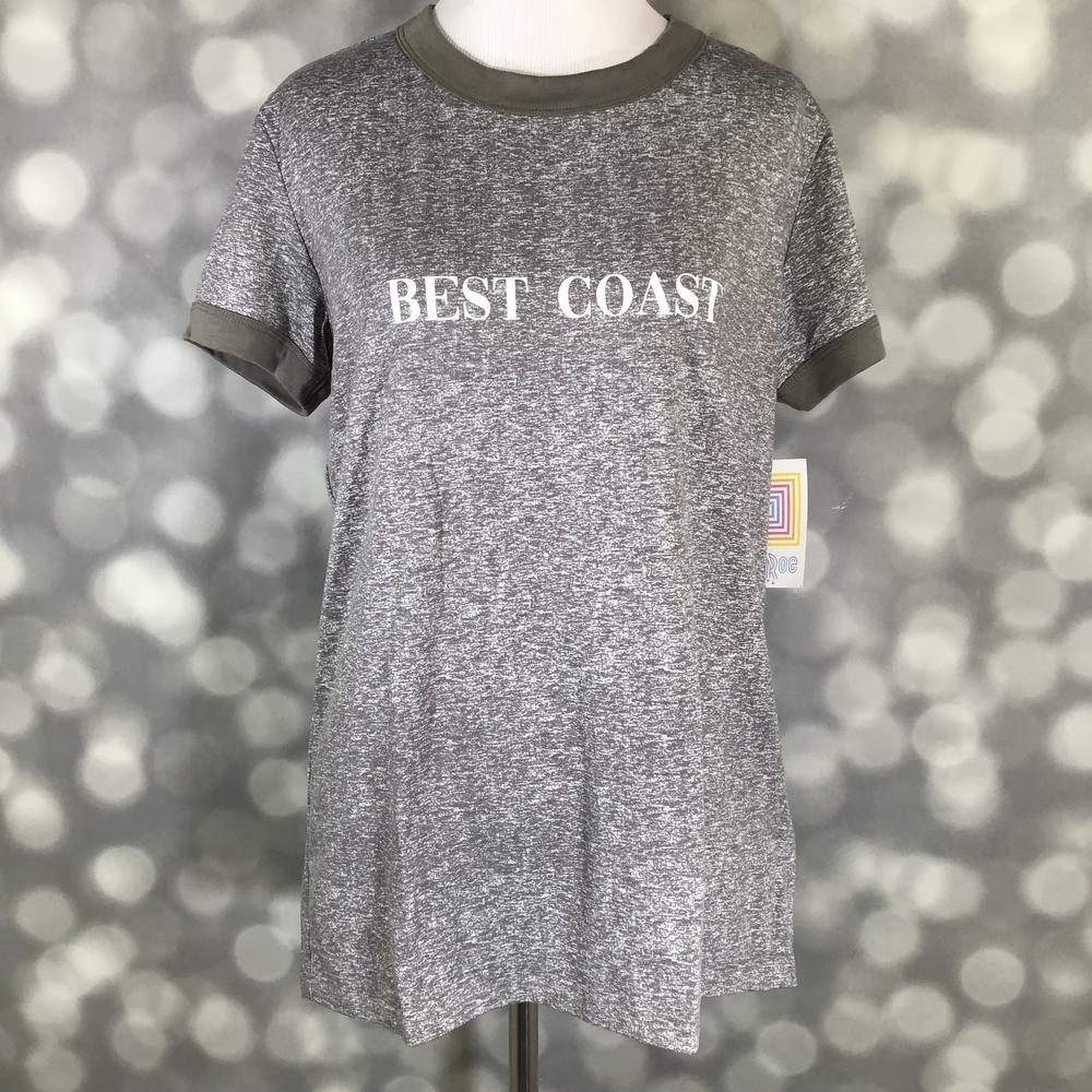 LuLaRoe Liv Tee in heather gray with olive trim and “Best Coast” graphic text, featuring short sleeves, relaxed fit, and curved hem displayed on a mannequin against a blurred background
