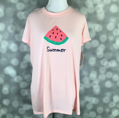 LuLaRoe Liv tee in blush pink featuring a watermelon slice graphic with the word "Summer", short sleeves, crew neckline, relaxed fit, displayed on a mannequin on a blurred gray background