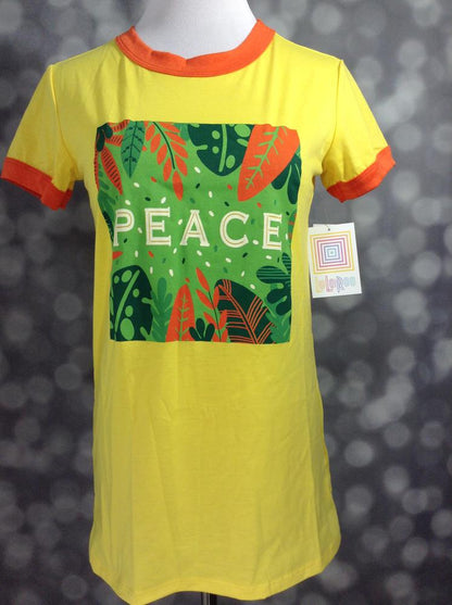 LuLaRoe Liv Tee yellow shirt with 'PEACE' tropical leaf graphic and orange ringer trim on a mannequin against a blurred background