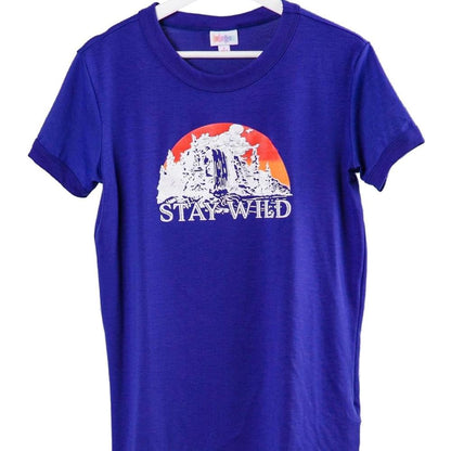 LuLaRoe Liv Tee blue shirt with 'Stay Wild' desert sunset cactus graphic design on a white background