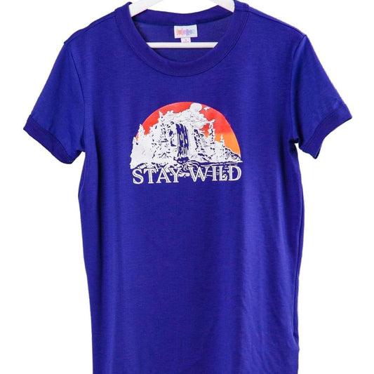 LuLaRoe Liv Tee blue shirt with 'Stay Wild' desert sunset cactus graphic design on a white background