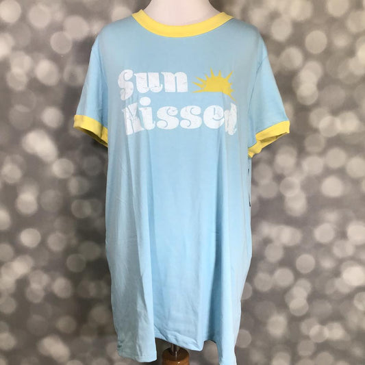 LuLaRoe Liv tee light blue ringer shirt with yellow trim with sun icon and 'Sun Kissed' text on a blurred gray background