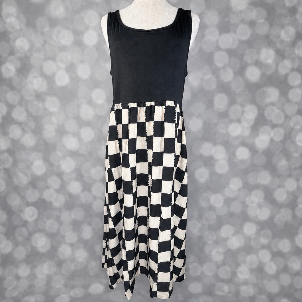 LuLaRoe Madeline Midi Tank Dress with a solid black tank bodice and black and ivory painterly checkerboard print midi skirt.