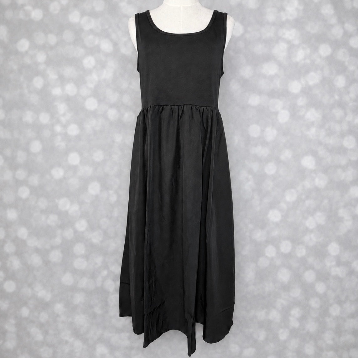 LuLaRoe Madeline Midi Tank Dress in solid black with a sleeveless tank bodice, gathered waist and flowing A-line midi skirt.
