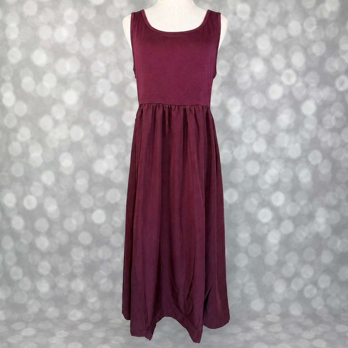 LuLaRoe Madeline Midi Tank Dress in solid deep plum with a sleeveless tank bodice, gathered waist and flowing A-line midi skirt.