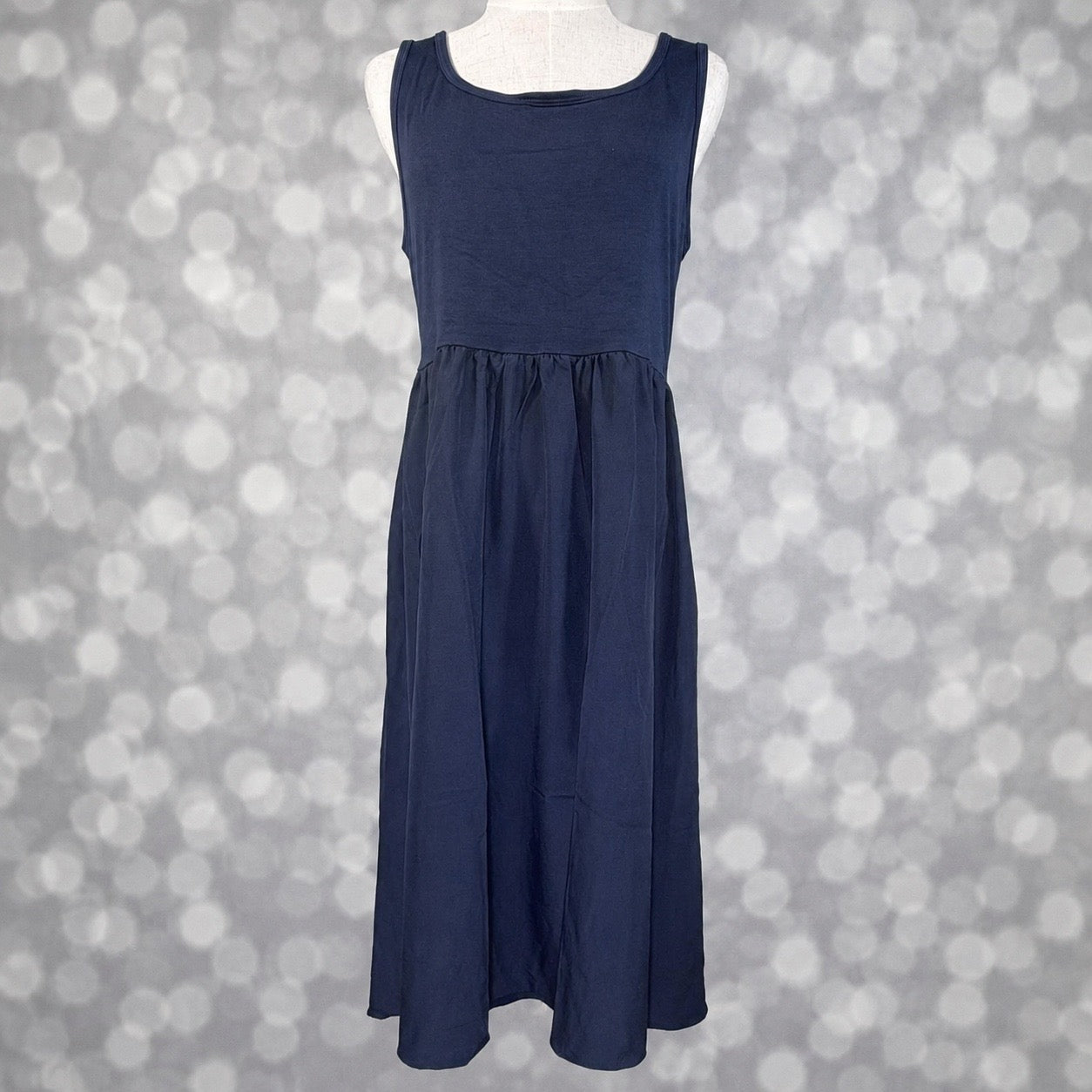 LuLaRoe Madeline Midi Tank Dress in solid navy with a sleeveless tank bodice, gathered waist and flowing A-line midi skirt.