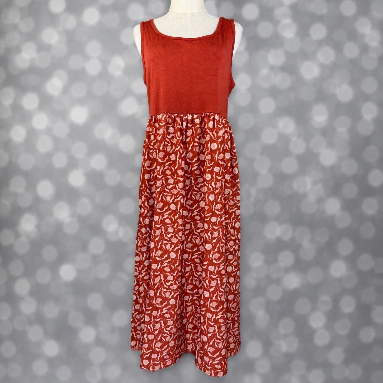 LuLaRoe Madeline Midi Tank Dress with a terracotta tank bodice and coordinating skirt featuring a light botanical vine print.