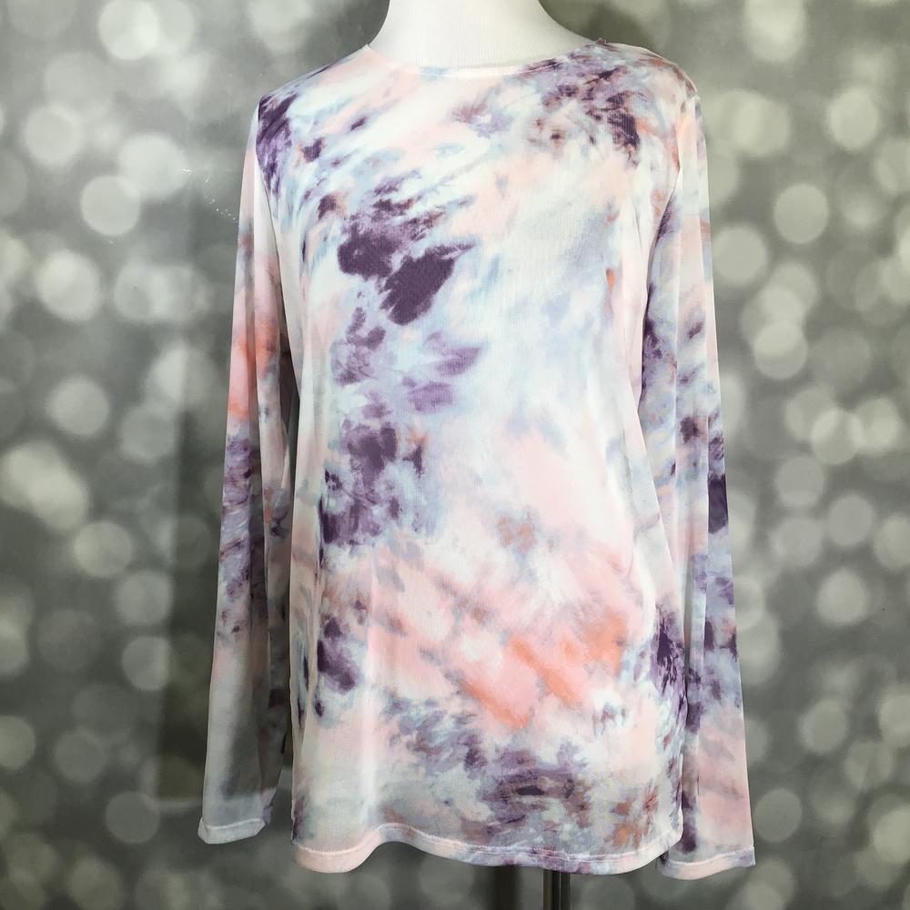 Tie-dye long-sleeve top on a mannequin against a blurred background