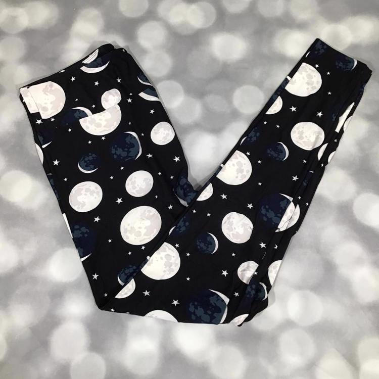 LuLaRoe leggings featuring moon phases and stars in grayscale and navy on a black background