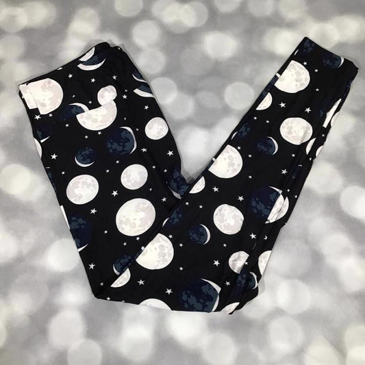 LuLaRoe leggings featuring moon phases and stars in grayscale and navy on a black background