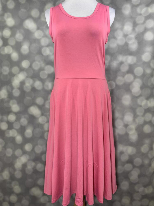 LuLaRoe Nicki sleeveless dress in a vibrant solid pink on mannequin