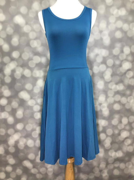 LuLaRoe Nicki sleeveless dress on a mannequin in a rich teal blue