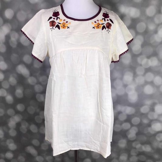 LuLaRoe Paisley Top in cream cotton slub with maroon embroidered floral design and delicate trim details.