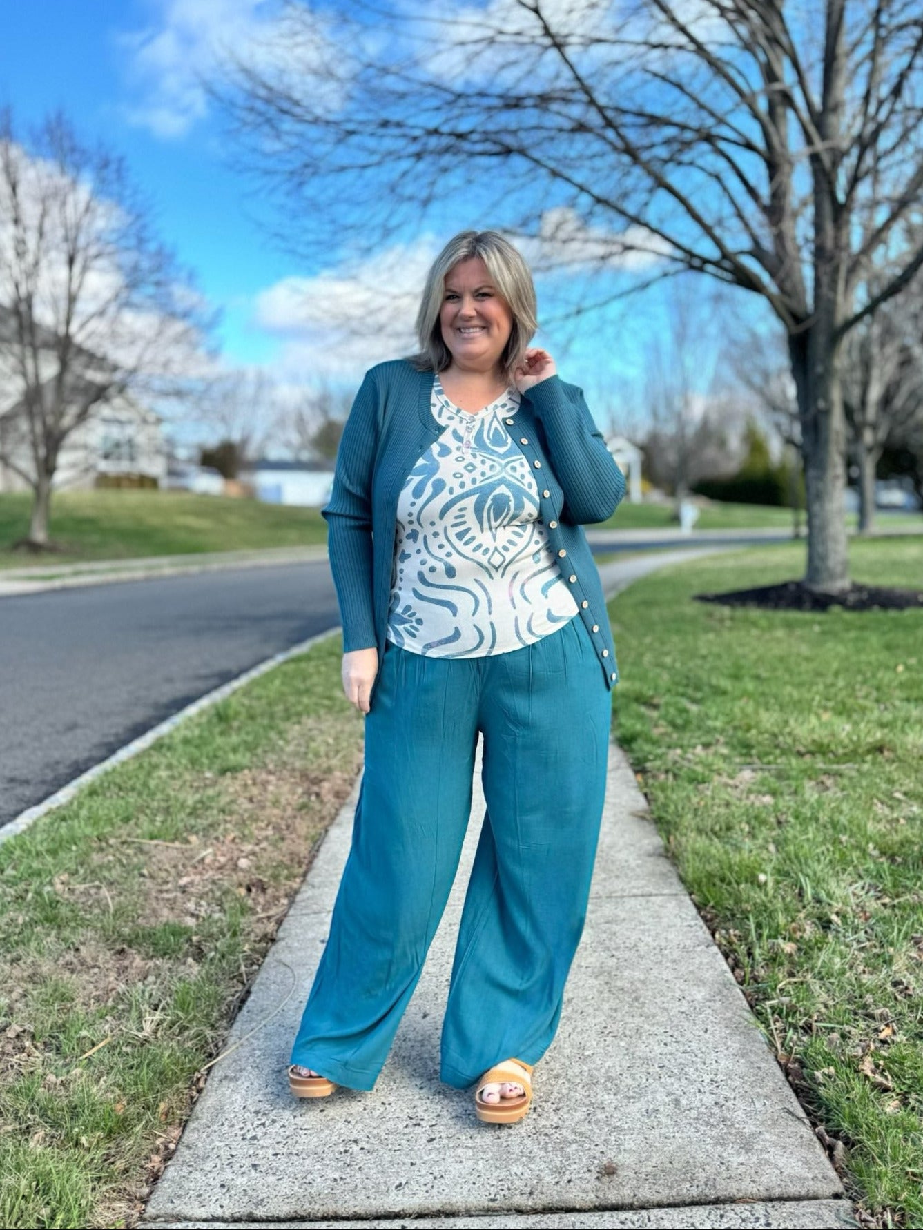 LuLaRoe Pamela Trouser in solid coastal teal breeze color, flowy wide leg pants styled outdoors with matching cardigan and patterned top