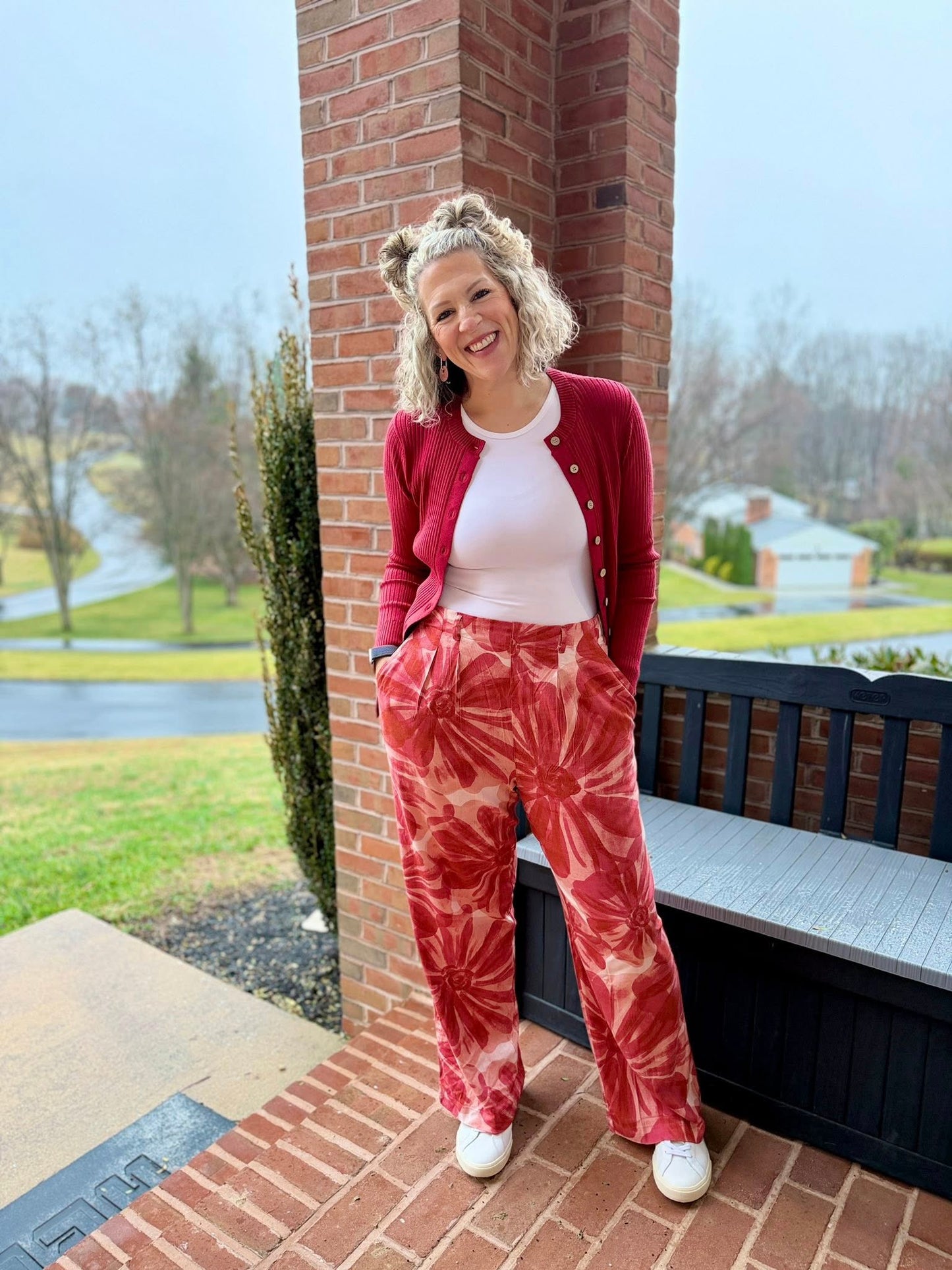 LuLaRoe Pamela Trouser in coral and red floral watercolor print, wide leg flowy pants styled with red cardigan and neutral top outdoors