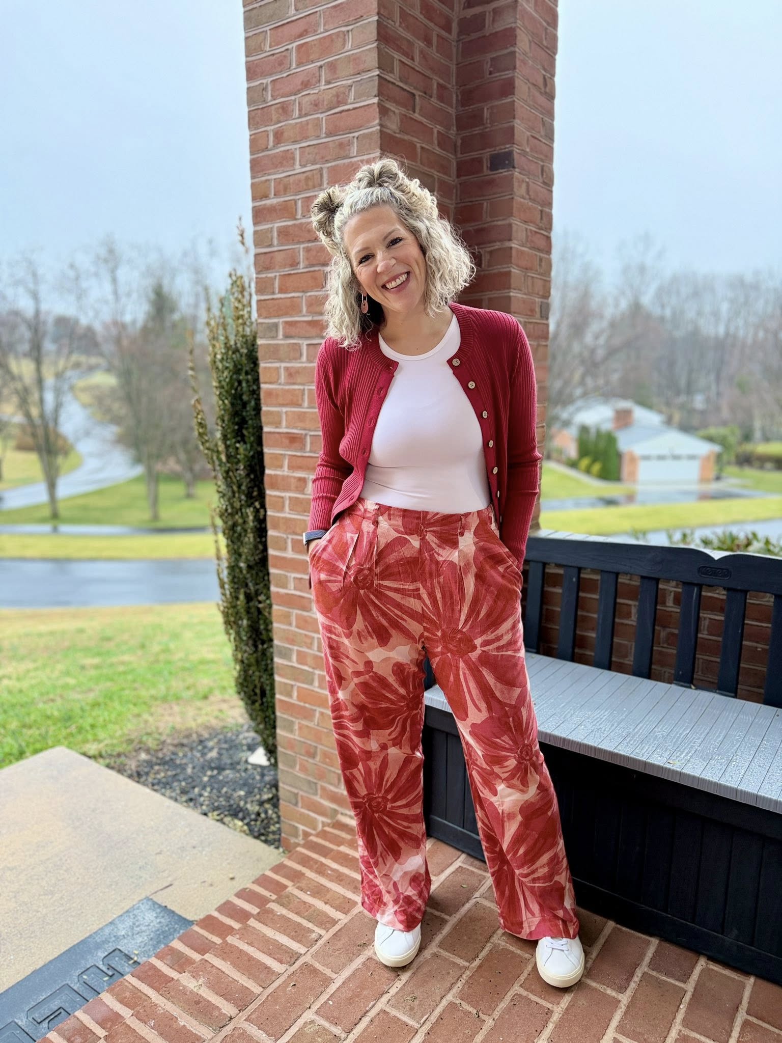 LuLaRoe Pamela Trouser in coral and red floral watercolor print, wide leg flowy pants styled with red cardigan and neutral top outdoors
