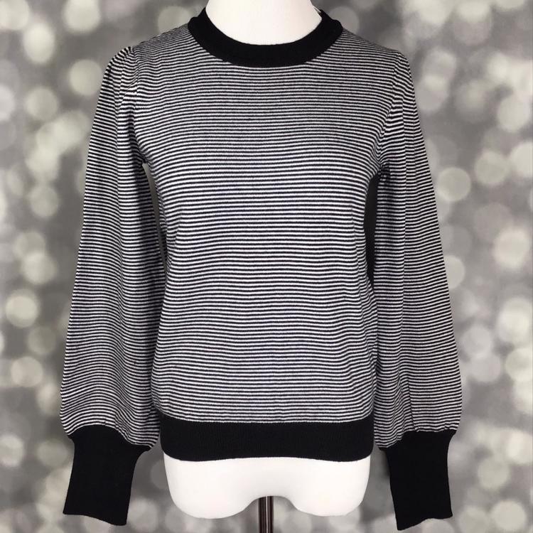 LuLaRoe Piper Sweater in black and ivory micro stripe knit with solid black ribbed neckline, hem, and extended cuffs and balloon sleeves displayed on mannequin against gray background.