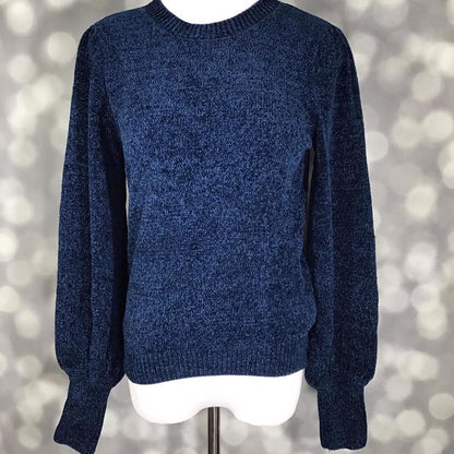 LuLaRoe Piper Sweater in solid deep navy blue knit with ribbed neckline, hem, and extended cuffs and balloon sleeves displayed on mannequin against gray background.