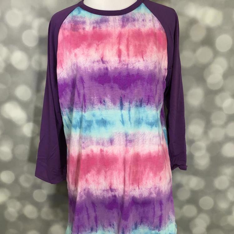 LuLaRoe Randy Tee with purple raglan sleeves and multicolor purple, pink, and aqua tie-dye style print in a relaxed long sleeve top on a mannequin