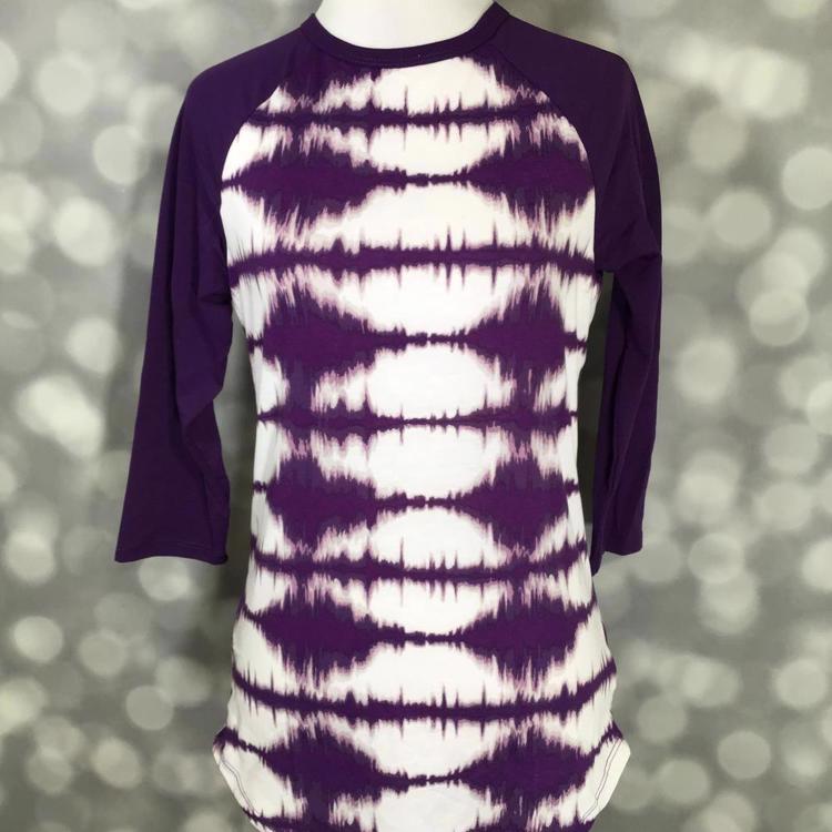 LuLaRoe Randy Tee with purple tie-dye body and solid purple raglan sleeves on a mannequin