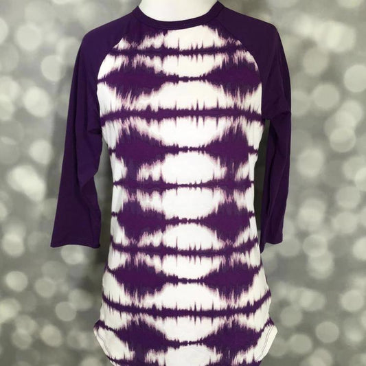 LuLaRoe Randy Tee with purple tie-dye body and solid purple raglan sleeves on a mannequin