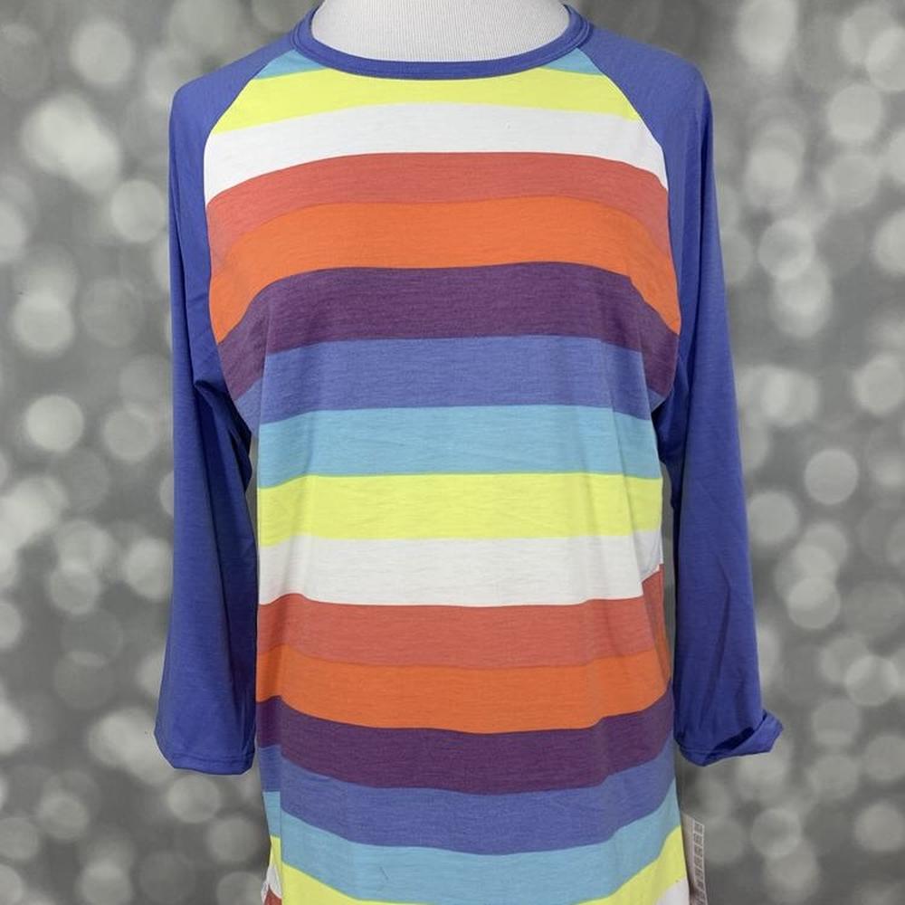 LuLaRoe Randy Tee with multicolor horizontal stripes and blue raglan sleeves on a mannequin against a blurred gray background