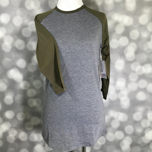 LuLaRoe Randy Tee with heather gray body and olive green long sleeves on a mannequin against a blurred background