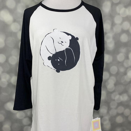 LuLaRoe Randy Tee with black sleeves and panda yin-yang graphic on cream body on a gray background