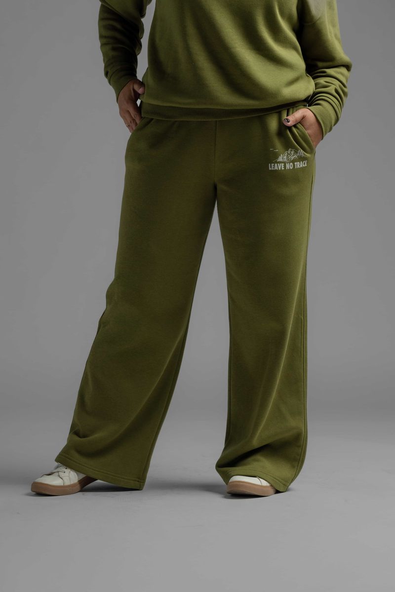 Close-up of LuLaRoe RISE Recharge Pull-On Sweatpant in Leave No Trace olive green fleece with wide-leg fit and small Leave No Trace graphic on hip, styled with matching pullover on studio background.