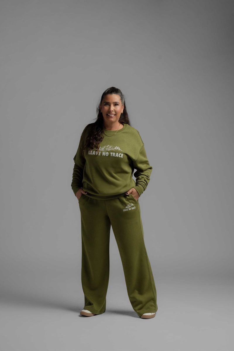 LuLaRoe RISE Reset Crew Neck Pullover in moss green cotton blend fleece featuring Leave No Trace mountain graphic and relaxed loungewear fit against a gray background