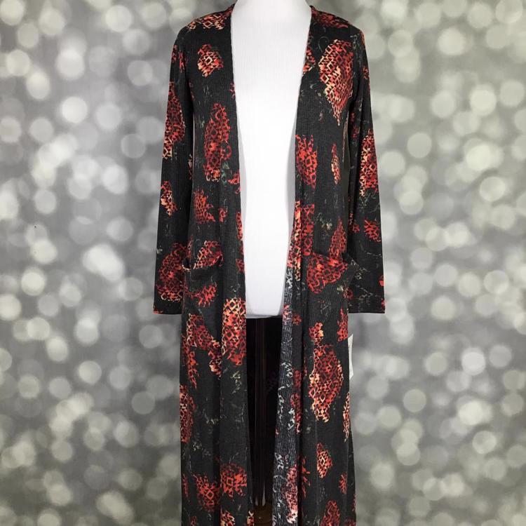 LuLaRoe Sarah Cardigan in reddish background with black Aztec print, lightweight mid-calf cardigan, cropped long sleeves