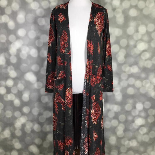 LuLaRoe Sarah Cardigan in reddish background with black Aztec print, lightweight mid-calf cardigan, cropped long sleeves